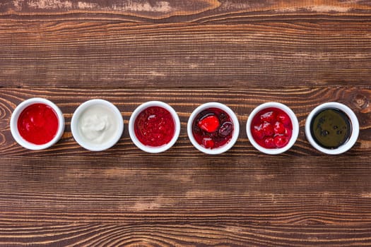 Overhead view of assortment of fruit puree. Jam, confiture, chutney or sauce from berries.