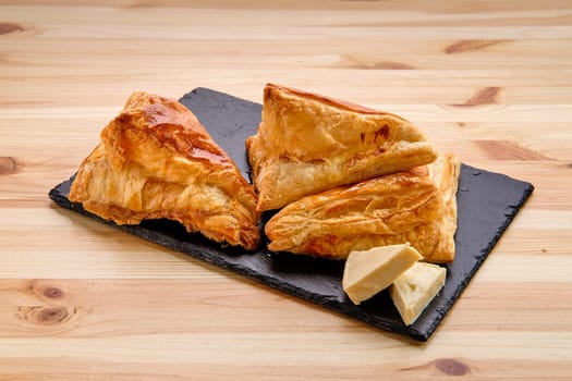khachapuri with cheese on slate plate