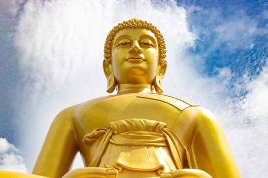 "Phra Buddha Dhammakaya Thep Mongkol"" is a Big golden buddha statue made of copper, as tall as a 20-storey building (69 meters), located at Wat Paknam Bhasicharoen. Bangkok, Thailand on a sunny day"