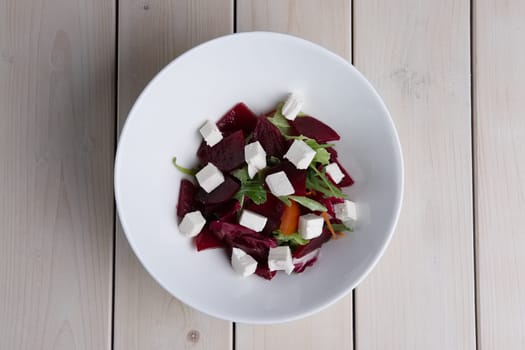 Top view of salad with beetroot, radish, pepper and feta cheese