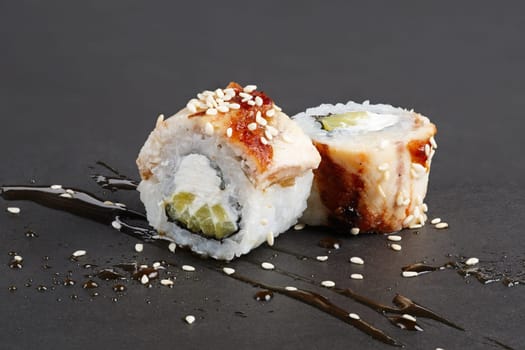 Eel rolls with cucumber, sesame, cheese