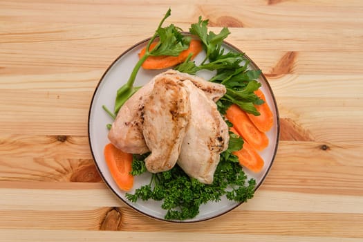 Fried chicken fillet on wooden table