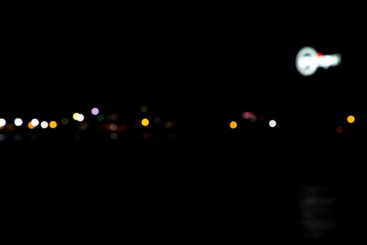 Abstract colorful bokeh light effects on the night black background texture