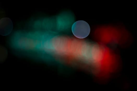 Abstract colorful bokeh light effects on the night black background texture