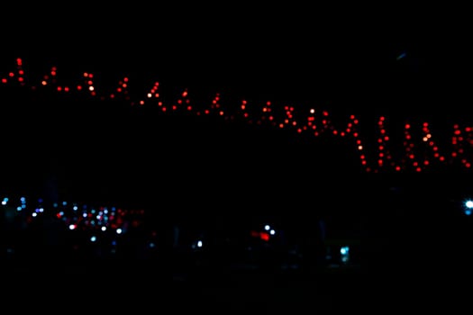 Abstract colorful bokeh light effects on the night black background texture