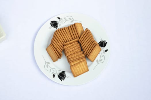 Top View Brown-wheat Biscuits in the Plate isolated Background