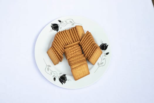Top View Brown-wheat Biscuits in the Plate isolated Background