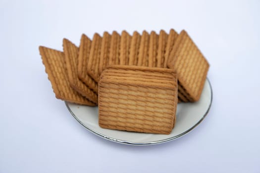 Brown color Wheat biscuits in the Plate isolated on Background