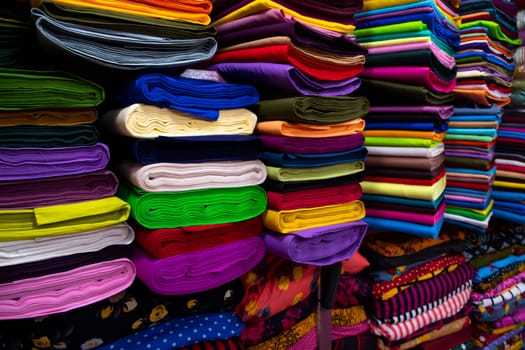 Artistic variety shade tone colors Textile Fabrics stacked on retail Shop Shelf to sale