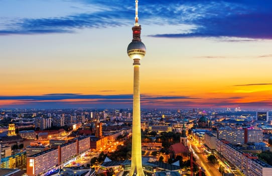 Aerial downtown panorama of Berlin at night with the skyscrappers and the bridges, Germany.