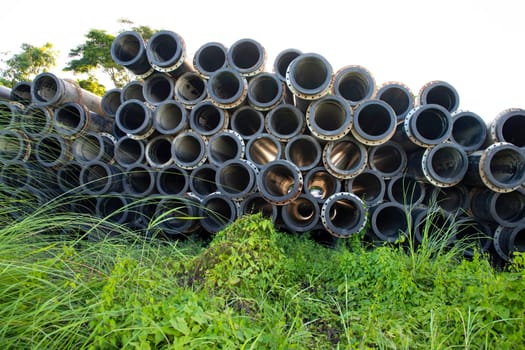 Background of black plastic Rubber pipes used at the River Dressing. Light through tubes