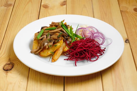 Fried potato, beetroot, pickled cabbage and mushrooms