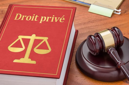 A law book with a gavel - Private law in french - Droit privé