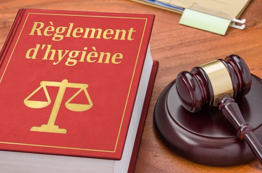 Law book with a gavel - Hygiene Regulations in french - Règlement d'hygiène