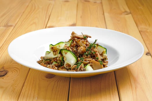 Boiled  buckwheat with marinated mushrooms and fresh cucumber