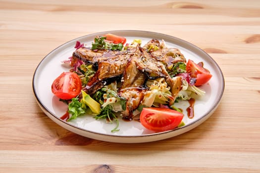 Salad with smoked eel with avocado and tomato
