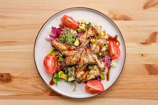 Salad with smoked eel with avocado and tomato