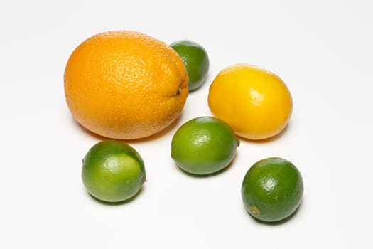 Top view of lemon, lime and orange on a white background with shadow