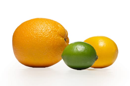The composition of lemon, lime and orange on a white background with shadow