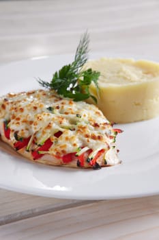 Fried chicken fillet with bell pepper, zucchini, melted cheese and mashed potato