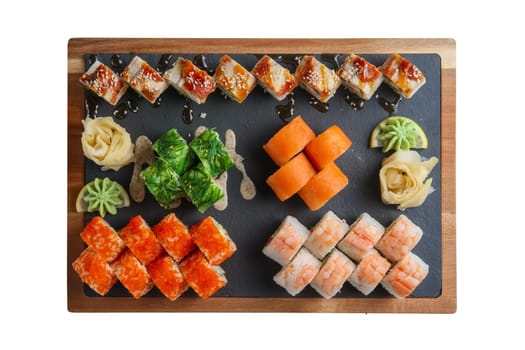 Big set of rolls served on stone plate isolated on white