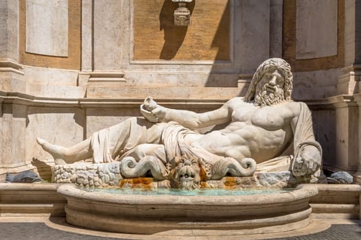 ROME, ITALY - CIRCA AUGUST 2020: famous Greek sculpture of Ocean god, named Marforio. Classic mythology in art.