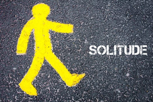 Yellow pedestrian figure on the road walking towards SOLITUDE. Conceptual image with Text message over asphalt background.