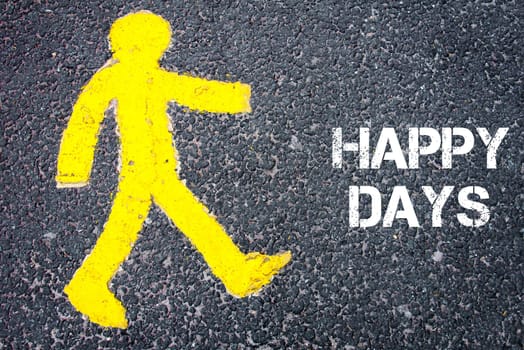 Yellow pedestrian figure on the road walking towards HAPPY DAYS. Conceptual image with Text message over asphalt background.