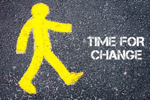 Yellow pedestrian figure on the road walking towards TIME FOR CHANGE. Conceptual image with Text message over asphalt background.