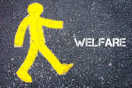 Yellow pedestrian figure on the road walking towards WELFARE. Conceptual image with Text message over asphalt background.