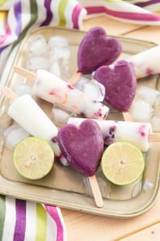 Homemade ice cream on the stem with fresh fruit