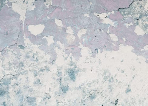 old blue earthen wall with peeling paint as background