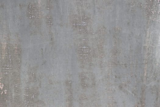 gray scratched metal surface with peeling paint