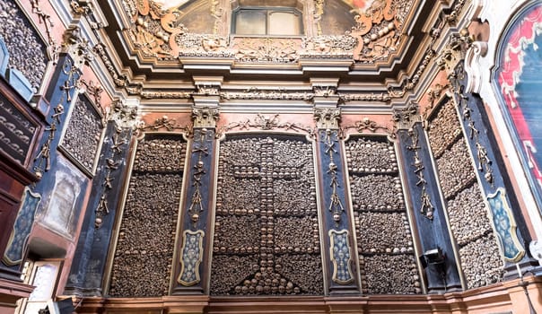 Milan, Italy - Circa August 2020. Ossuary Chapel in San Bernardino alle Ossa Church. Every architectural detail is clad in human bones.