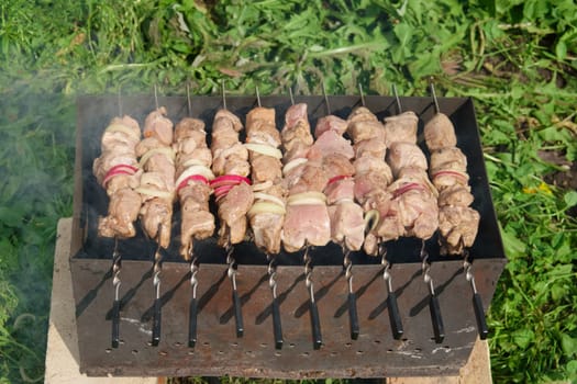 Process of cooking shashlik from pickled meat outdoor, img 5 of 17