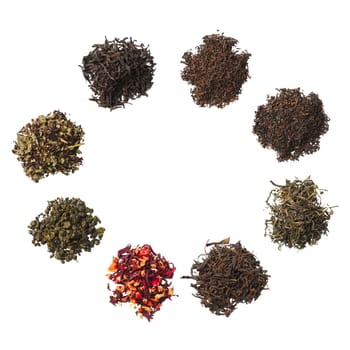 Heap of dried herbal tea leaves isolated on white. Top view.
