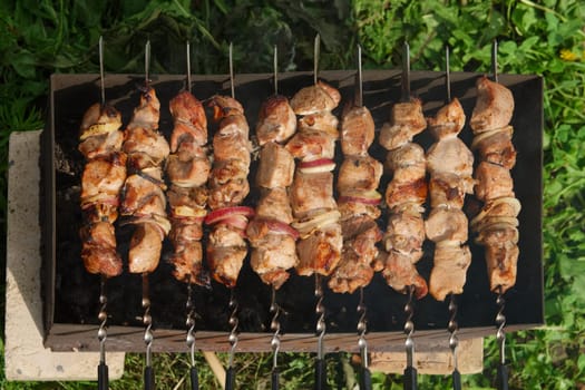 Process of cooking shashlik from pickled meat outdoor, img 10 of 17