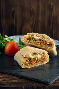 Spicy ciabatta stuffed with fried beef mince, chilli, mozzarella, tomato, bell pepper