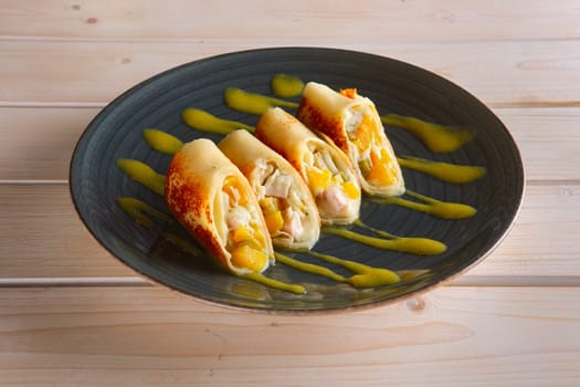 Thin pancakes with chicken and pineapple
