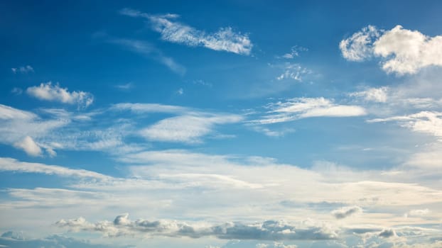 Landscape of a beautiful blue sky covered with cumulonimbus clouds on a summer afternoon. Unspoiled nature.