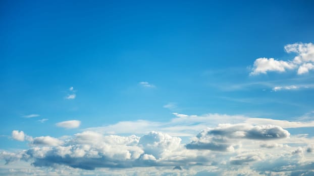 Landscape of a beautiful blue sky covered with cumulonimbus clouds on a summer afternoon. Unspoiled nature.