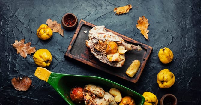 Homemade chicken baked with apples in a baking dish.