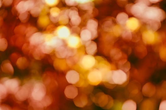 Abstract bokeh golden background with christmas blur lights and decoration. Xmas and new year design backdrop.