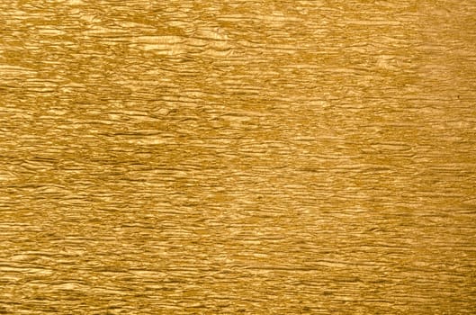 Abstract golden textured background with christmas wrap paper decoration. Xmas and new year design backdrop.