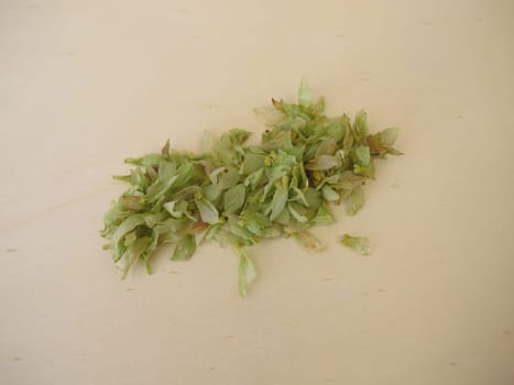 Dried hop flowers on a wooden board