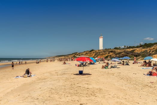 Tourists on the beach of Matalascanas, Andalusia, Spain