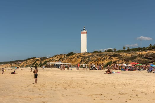 Tourists on the beach of Matalascanas, Andalusia, Spain