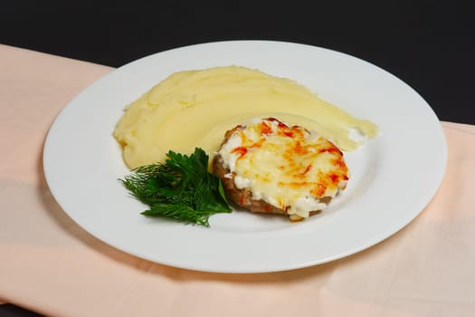 Plate with meat cutlet with cheese and mashed potato