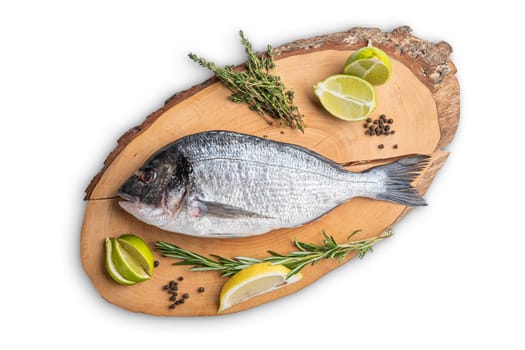 Fresh raw dorada on wooden cutting board, top view