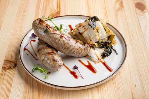 Fried Weisswurst (white veal sausage) with marinated cabbage and sea wed